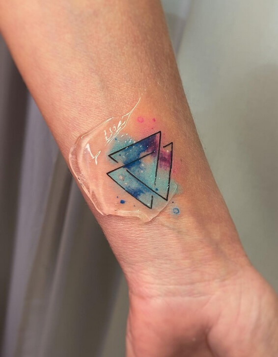 Colorful Triangle Tattoo On Hand-20 Motivational Triangle Tattoo Ideas in 2023