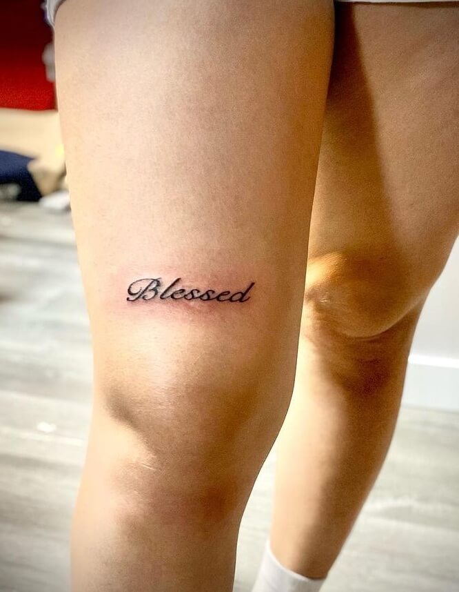 Cursive Blessed Tattoo Image Over The Knee