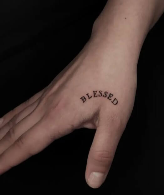 Curved Blessed Tattoo On Hand