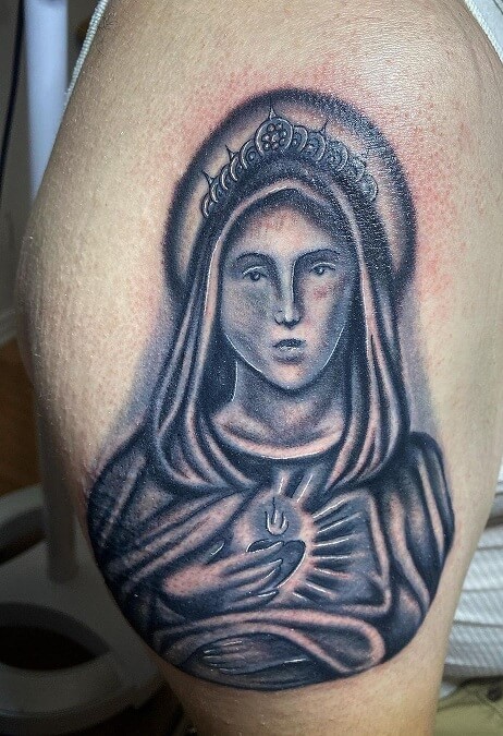Detailed Catholic Tattoo On The Bicep