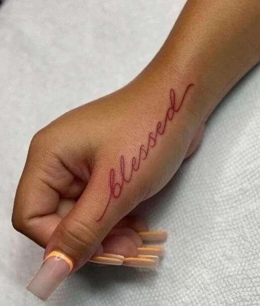 Fine Blessed Word Tattoo In Red