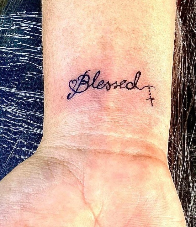 Graceful Blessed Cross Tattoo On The Wrist