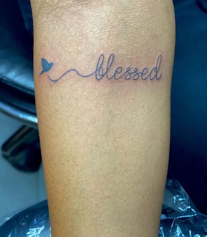 Simple Blessed Tattoo With A Little Bird In Blue