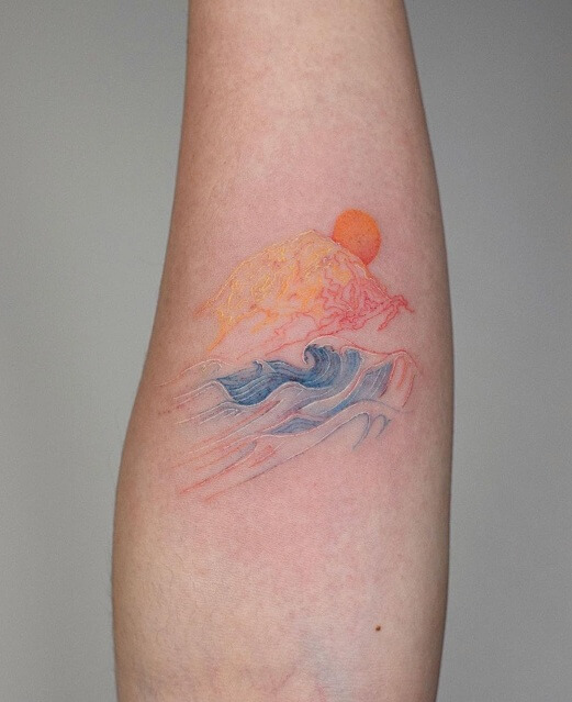 Wave Tattoo With The Rising Sun And Watercolor Effect