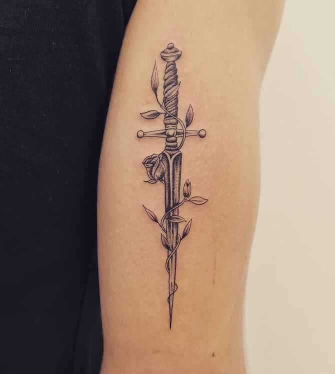Beautiful Sword Tattoo Design With Adding Floral Rose Elements