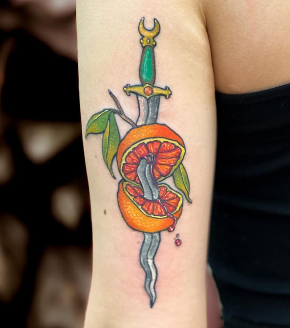 Creative Sword Through A Fruit Tattoo Design