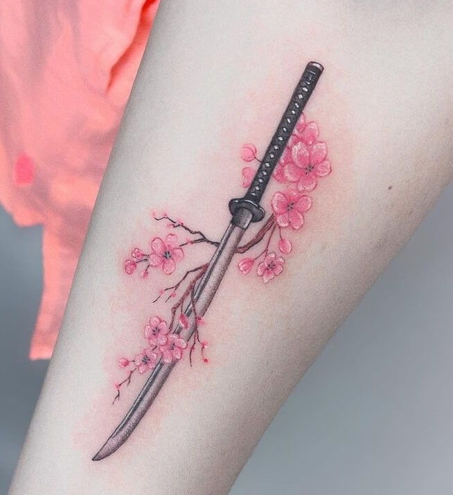 Gorgeous Sword Tattoo Design With Flowers