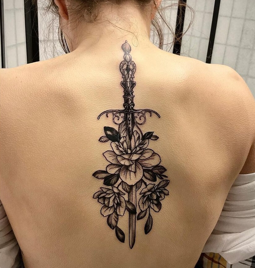 Stylish Rajput Sword Back Tattoo Design With Florals